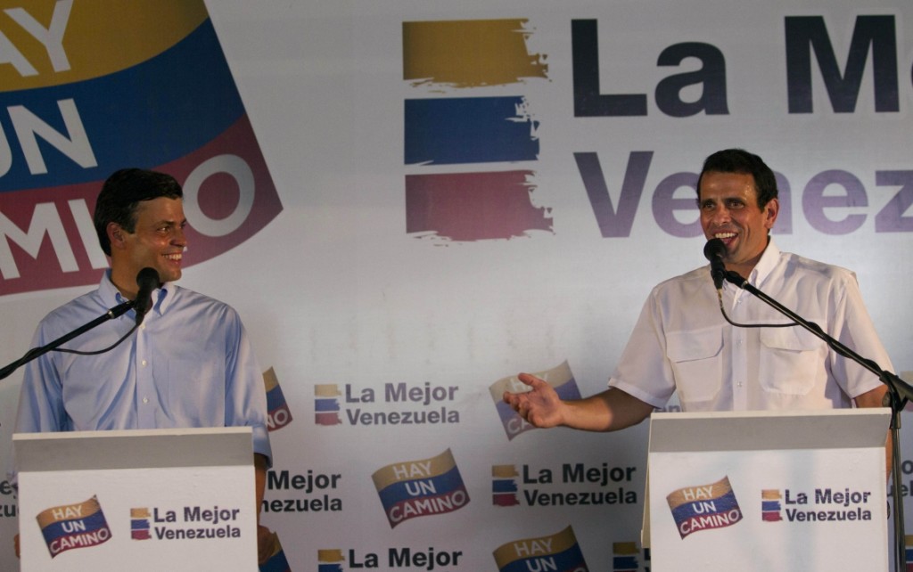 Opposition politician Leopoldo Lopez, left, and Henrique Capriles Radonski give a press conference in Caracas, Venezuela, Tuesday Jan. 24, 2012.  Lopez bowed out of Venezuela's presidential race on Tuesday, saying he will support front-runner Capriles.  The announcement gives a significant boost to Capriles, who has a commanding lead in the polls ahead of the Feb. 12 opposition primary, which will choose a single challenger to face President Hugo Chavez in the Oct. 7 presidential election. (AP Photo/Ariana Cubillos)